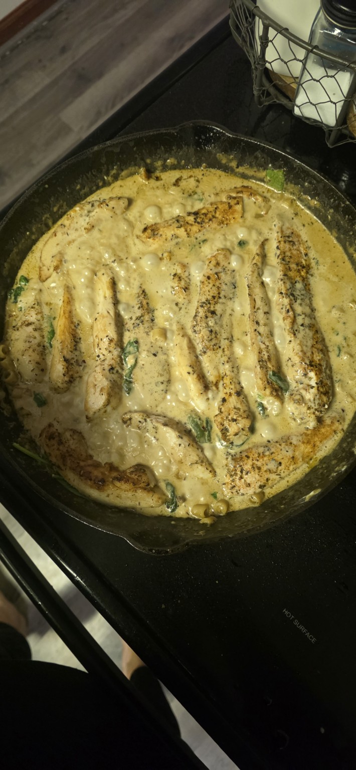 Cast iron skillet of garlic Parmesan chicken and ditalini